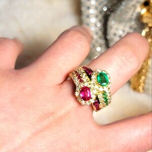 18 K ring with high-quality natural ruby, emerald, and diamonds.